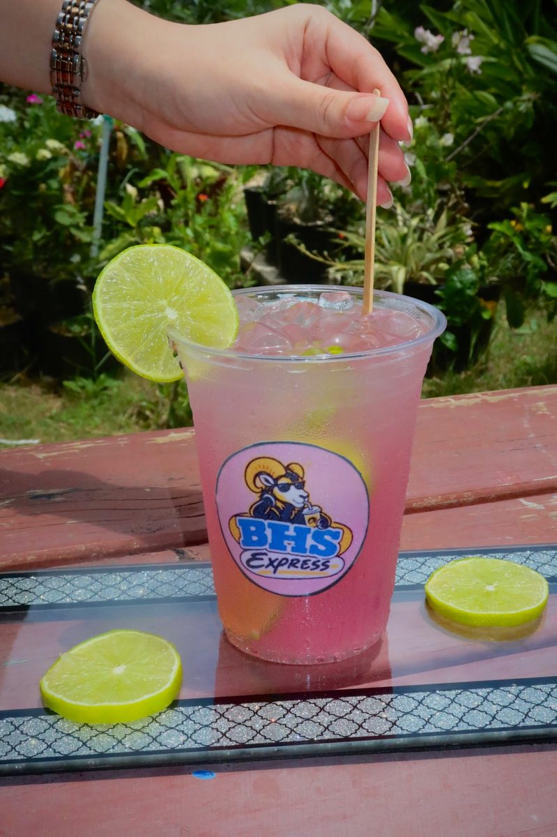 A pink BHS Express drink with lime garnish